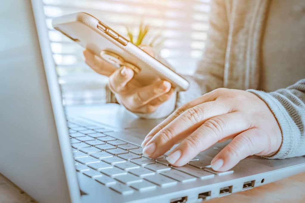 Woman browsing web on laptop