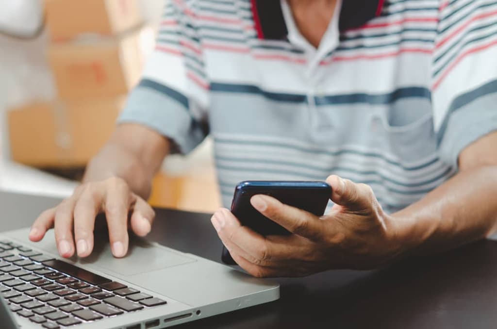 Man browsing web on laptop